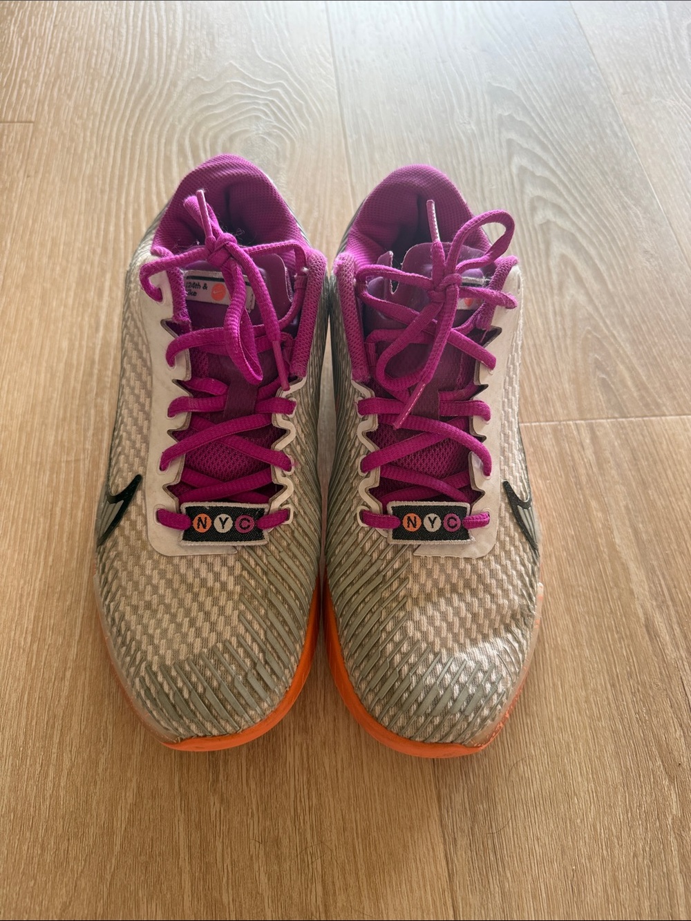 Nike Women's tennis Shoes with Pink Laces and Orange Outsole vapor 11